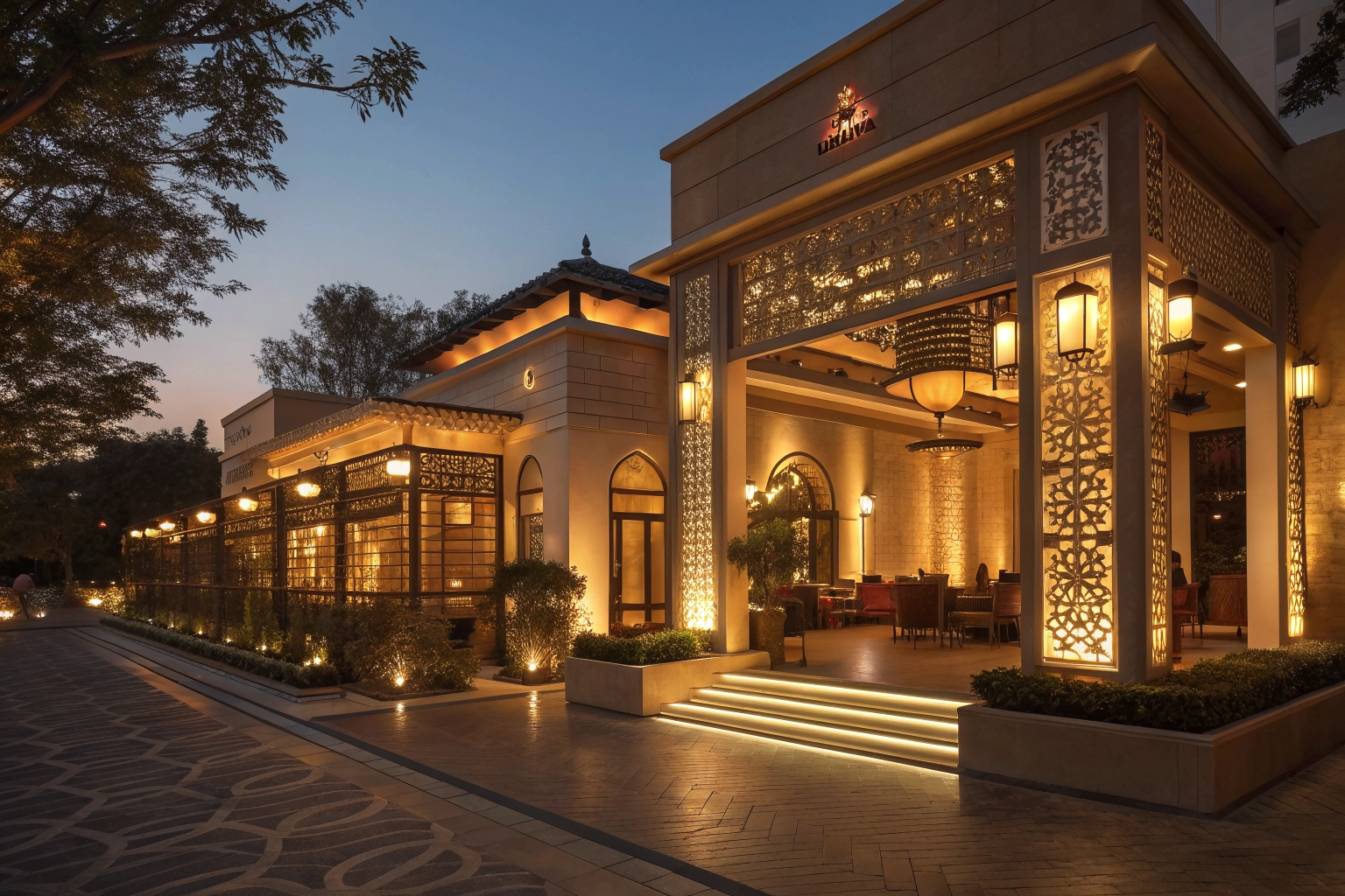 An Indian restaurant exterior at night with elegant lighting.